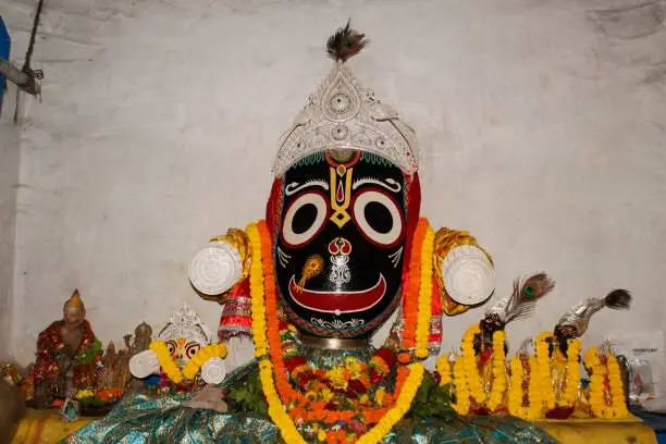 Photo of Deities to be worshipped. Closeup of a Colorful statue of Lord Jagannath deity. Indian religious icon