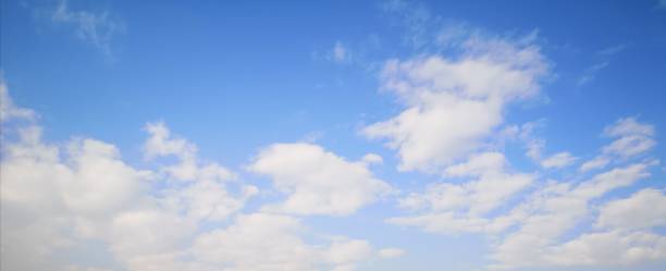 istock White​ clouds​ in the​ blue sky​ Cloudy natural background​ 1189748215