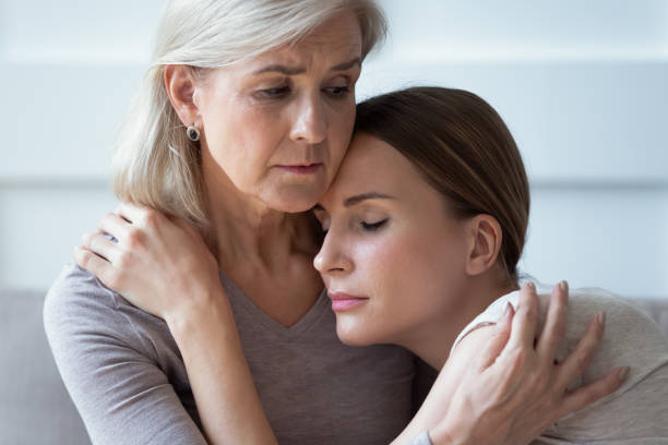 istock Unhappy young woman supporting stressed middle aged mommy. 1189748794