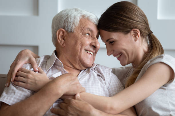 istock Laughing young 30s woman embracing happy older father. 1189748827
