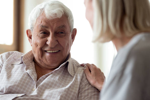 istock Smiling elder male patient communicating with nurse. 1189748849