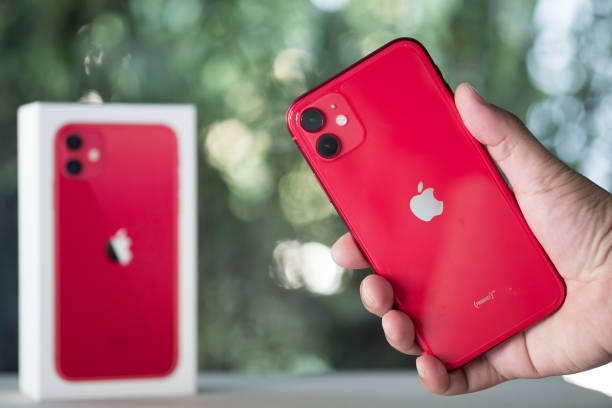 Apple Iphone 11 Product Red In Hand On Nature Background Closeup Of A New  Smartphone From Apple And A Box Stock Photo - Download Image Now - iStock