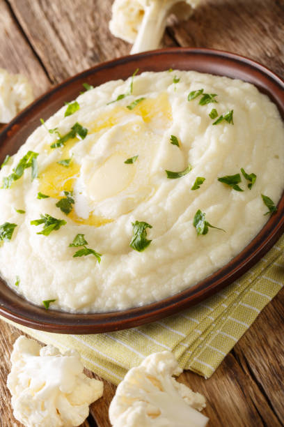istock mashed cauliflower with butter and parsley close-up on a plate. vertical 1189750902