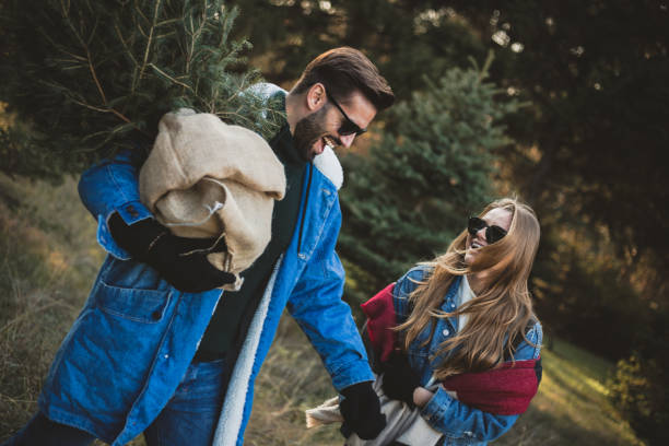 istock Happy couple found their Christmas tree in the woods 1189751005