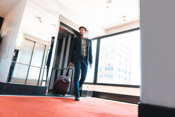 istock Businessman getting out of the elevator 1189751108