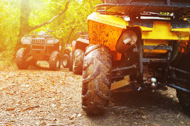 istock ATV in the forest, in the mud. Wheels and ATV elements close-up in the mud. Active leisure, sports and tourism. 1189751267