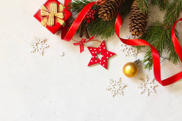 istock Christmas, new year concept background. Xmas composition. Branches of spruce, present and red decorations. Top view flat lay background. Copy space. 1189751289