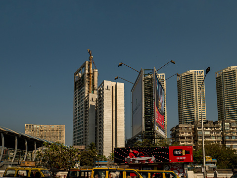 11 Apr 2019 High rise developments by Mahalaxmi Station and the Western Railways train of the Mumbai Suburban Railway, India