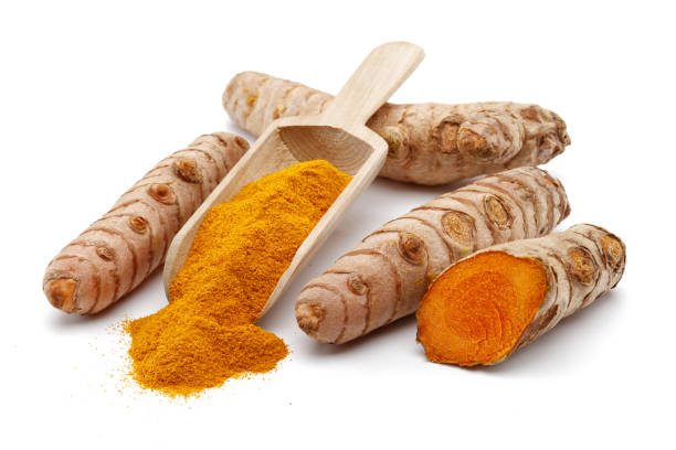 istock Fresh turmeric and curcuma in wooden spoon isolated 1189753521