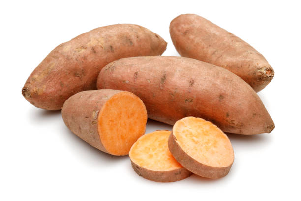 istock Sweet potatoes with slices isolated 1189753568