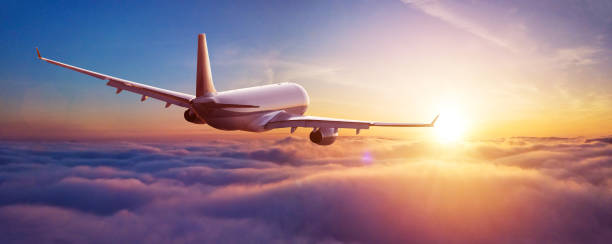 istock Passengers commercial airplane flying above clouds 1189754146