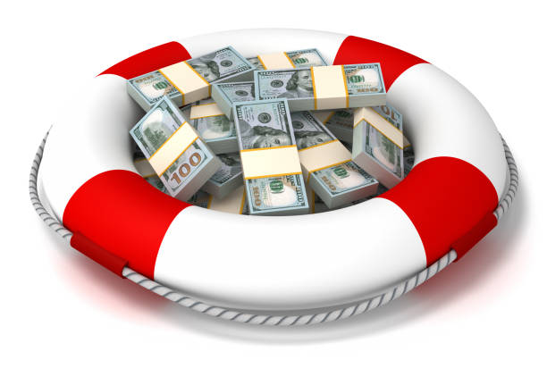 istock Life buoy and and stack of US Dollars 1189755496