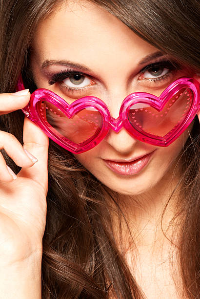 istock Girl with heart shaped sunglasses 118975712
