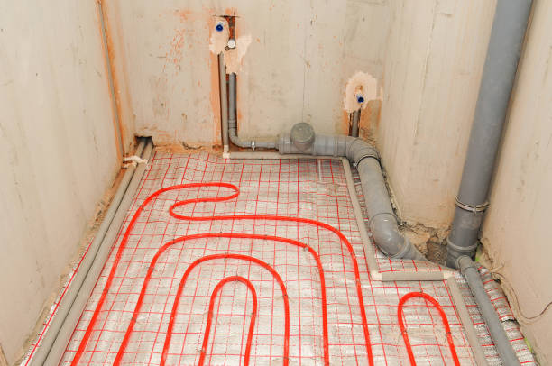 istock Installation water underfloor heating pipes on the silver reflective material in house construction. 1189761332