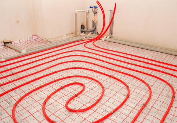 istock Installation water underfloor heating pipes on the silver reflective material in house construction. 1189761341