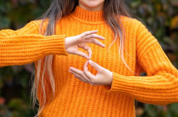 Deaf woman using sign language Deaf woman using sign language sign language stock pictures, royalty-free photos & images