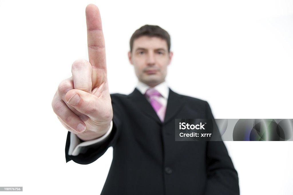 Un homme d'affaires tenant un doigt - Photo de Adulte libre de droits