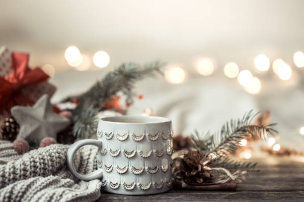 istock Festive background with Cup on wooden background with lights. 1189768001