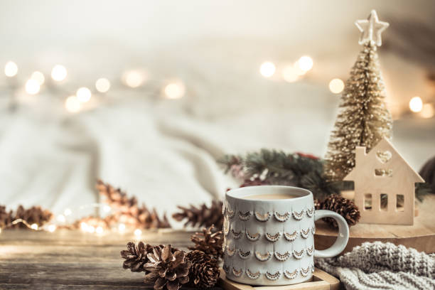 istock Festive background with Cup on wooden background with lights. 1189768005