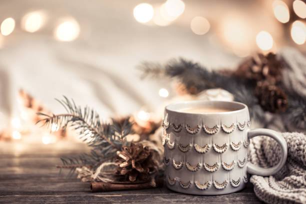 istock Festive background with Cup on wooden background with lights. 1189768008