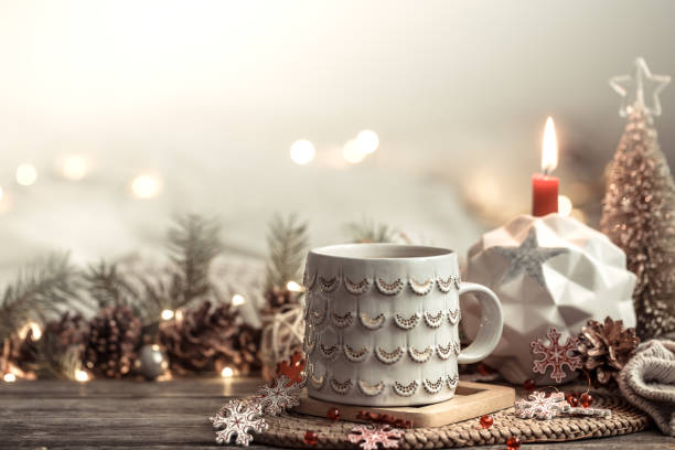 istock Festive background with Cup on wooden background with lights. 1189768009