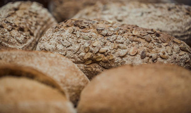 istock Fresh bread on the counter in the store, close-up . 1189769852