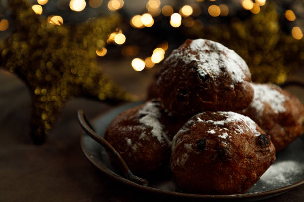 dutch oliebollen or dougnut balls with sugar for new years eve - oliebollen stockfoto's en -beelden