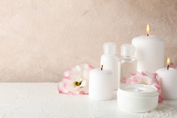 istock Spa accessories and beautiful flowers on white background, close up 1189773414