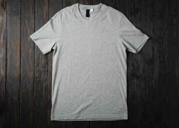 istock Blank gray t-shirt on wooden background, space for text 1189776426