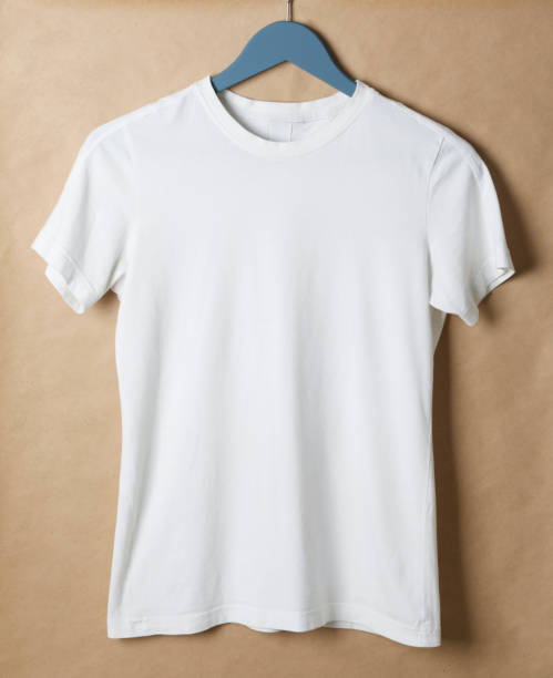 istock Hanger with blank white t-shirt on cardboard background, space for text 1189776732