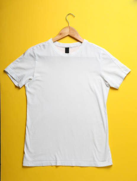 istock Hanger with blank white t-shirt on yellow background, space for text 1189776822