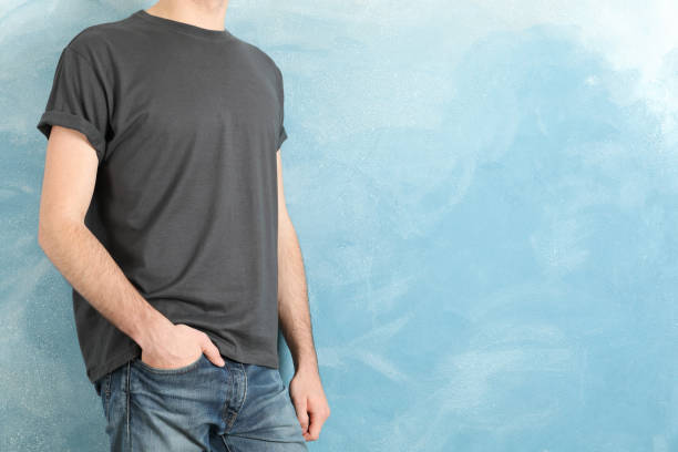 istock Men in blank grey t-shirt against blue background, space for text 1189776961
