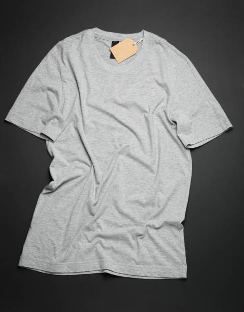 istock Crumpled blank gray t-shirt on black background, space for text 1189776976