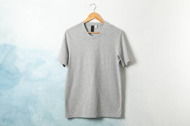 istock Hanger with blank gray t-shirt on blue background, space for text 1189777934
