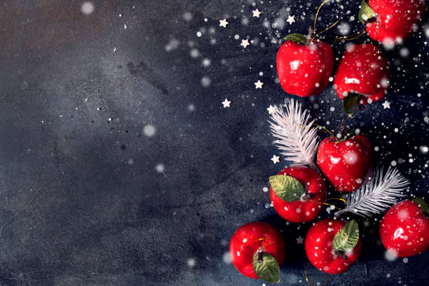 istock Christmas background with red apples festive decoration 1189778234