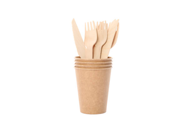 istock Eco - friendly cups with forks and knives isolated on white background. Disposable tableware 1189778532
