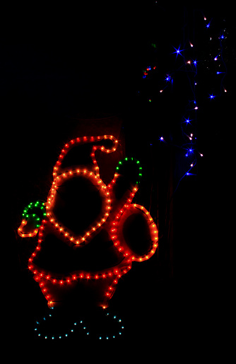 Bright Santa Claus with a sheaf of blue LED stars.