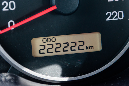 Car odometer reaches a two hundred and twenty-two thousand two hundred and twenty-two kilometres.