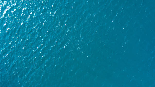 istock Sea blue water surface texture background, aerial view, vacation travel concept 1189779943