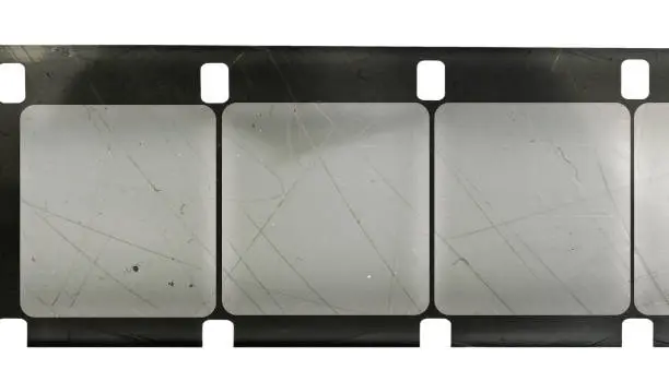 Photo of long 16mm film or movie strip with empty frames or cells on white background, just blend in your photos to make them look vintage