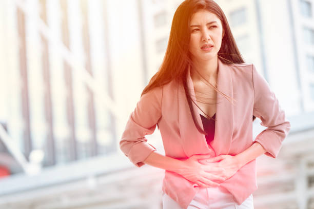 Asian woman front stomach painful sign of Ovarian Endometriosis and Chocolate Cyst syndrome. Asian woman front stomach painful sign of Ovarian Endometriosis and Chocolate Cyst syndrome. nephropathy photos stock pictures, royalty-free photos & images