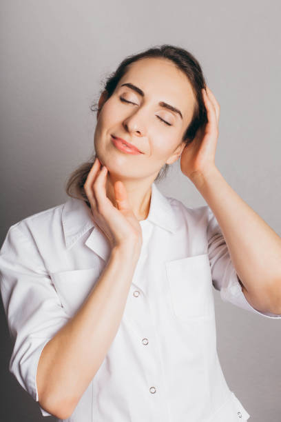 istock Portrait of a beautician in white uniform. 1189783596