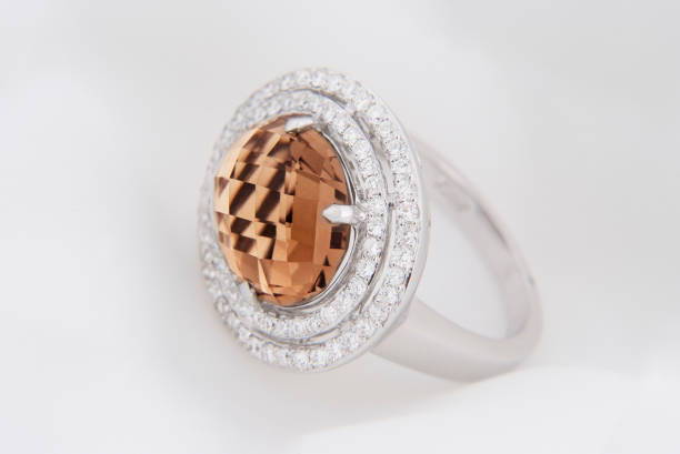 istock White Gold Ring With Smokey Topaz And Diamonds On Soft White Background 1189783889