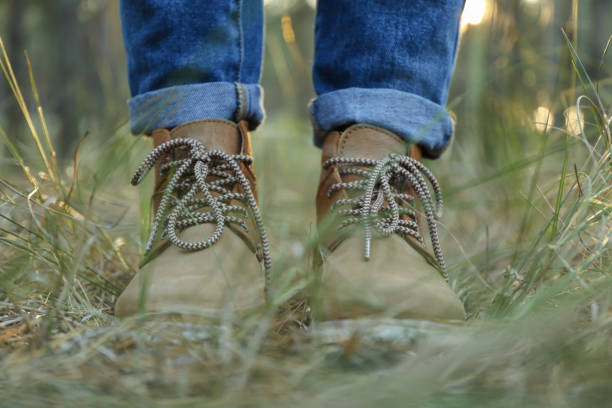 istock Person in boots and jeans. Walk in the forest 1189784193