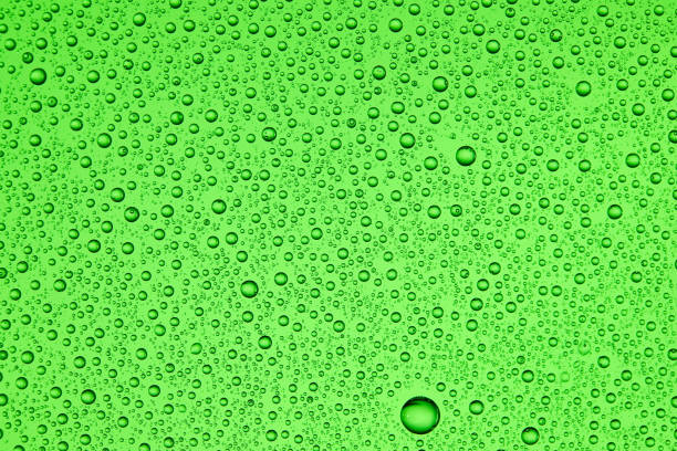 istock Drops on glass of different sizes and colors on a colored background, texture 1189786373
