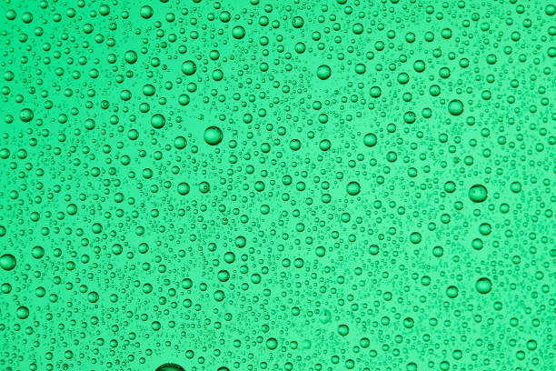 istock Drops on glass of different sizes and colors on a colored background, texture 1189786400