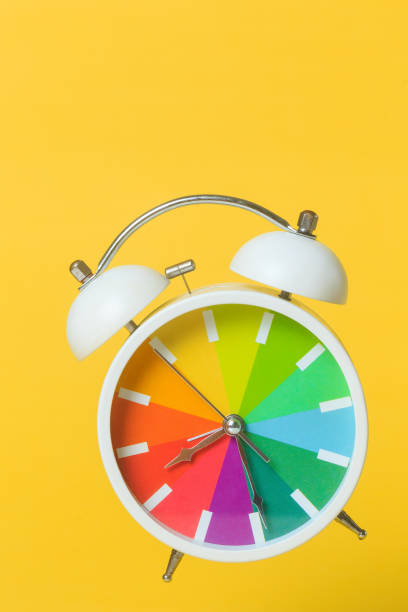 alarm clock flying isolated on a orange background abstract concept photography time flies - clock time alarm clock orange imagens e fotografias de stock