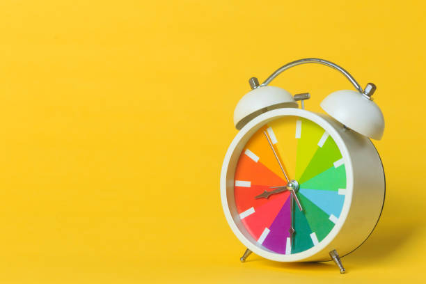 istock alarm clock isolated on a yellow background 1189789465