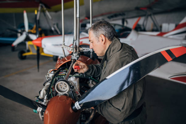istock Airplane mechanic repairing airplane 1189789526