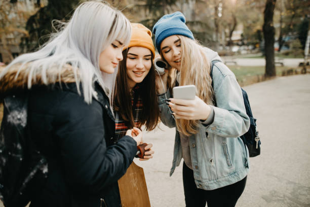 istock Cute female students in the campus park 1189789646
